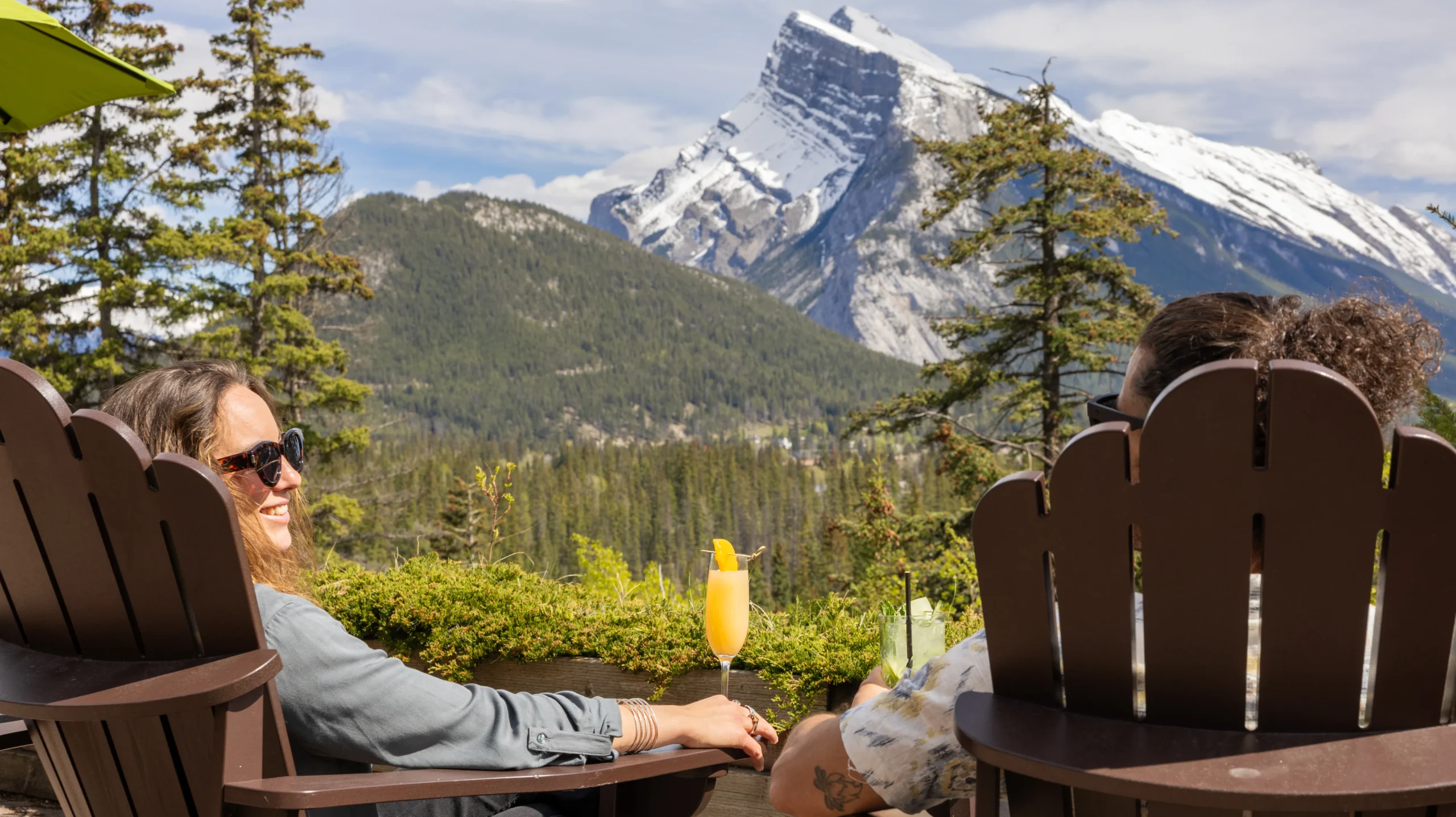 Guests overlooking the mountains from The Juniper patio